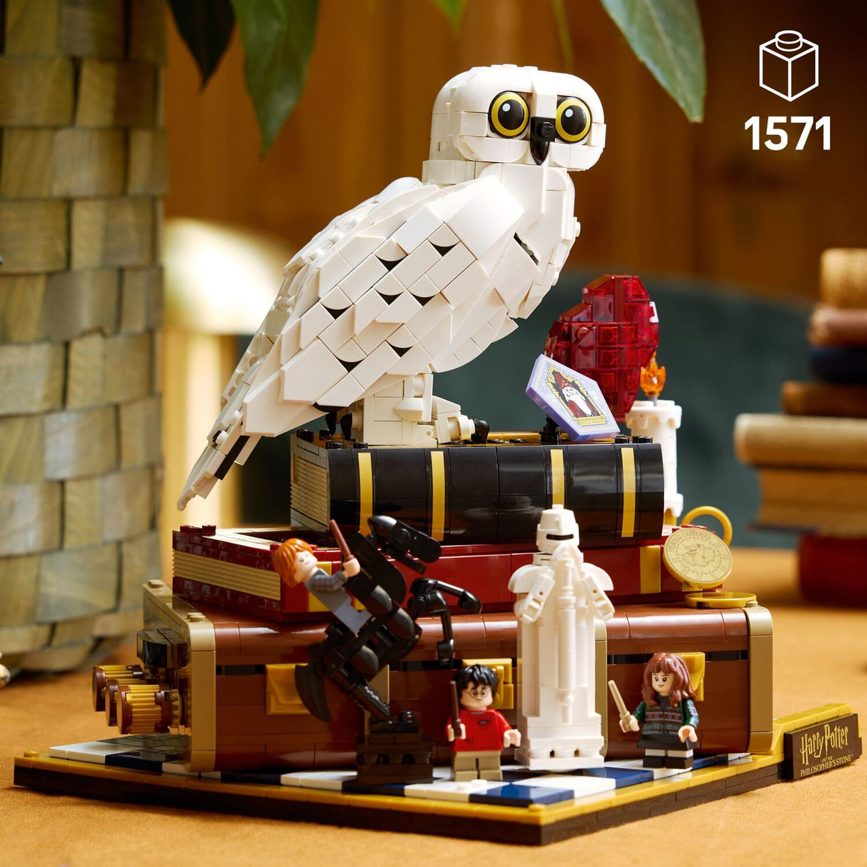 LEGO Harry Potter: Sorcerer's Stone – Collectors' Edition model of a Hedwig the owl on a platform with characters and objects, featuring the LEGO logo .