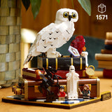 LEGO Harry Potter: Sorcerer's Stone – Collectors' Edition model of a Hedwig the owl on a platform with characters and objects, featuring the LEGO logo .
