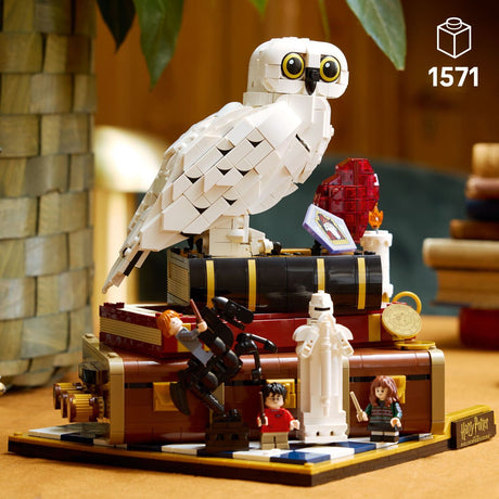 LEGO Harry Potter: Sorcerer's Stone – Collectors' Edition model of a Hedwig the owl on a platform with characters and objects, featuring the LEGO logo .