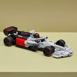 Toy LEGO Speed Champions: Audi Revolut F1® Team R26 Race Car with 'Revolut' branding on a beige background