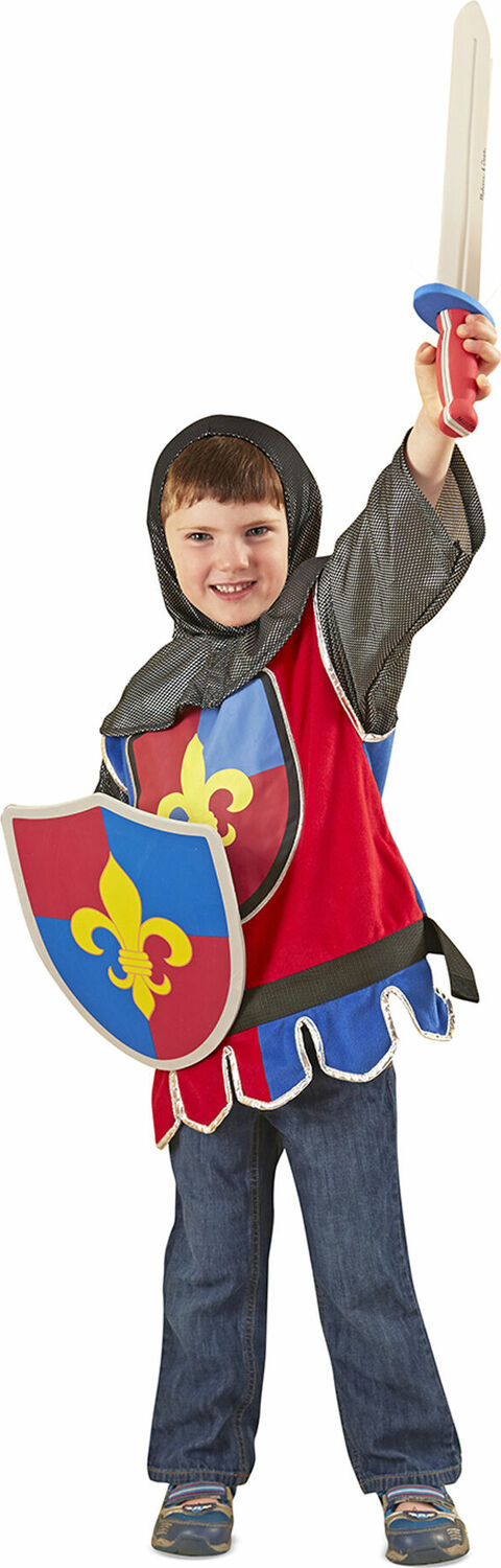 Child in a medieval Knight Role Play Costume Set with a shield and sword on a white background
