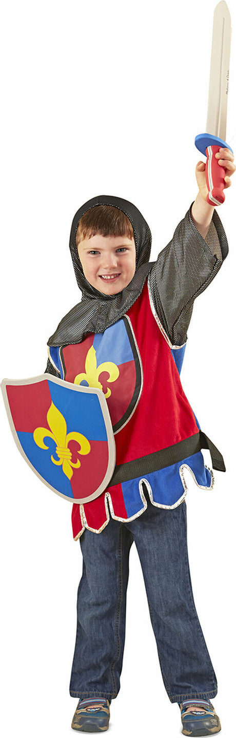 Child in a medieval Knight Role Play Costume Set with a shield and sword on a white background