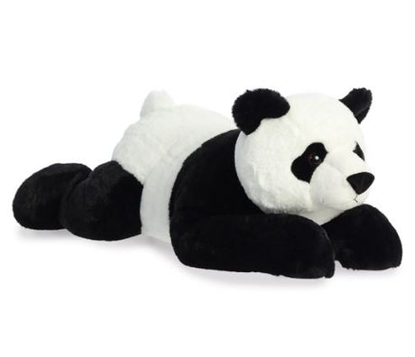 Plush panda toy lying on a white background