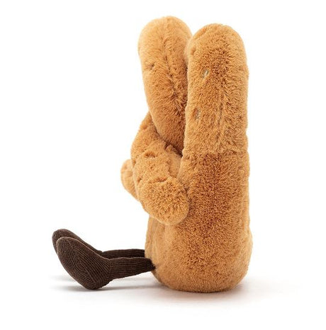 Soft brown plush toy shaped like a twisted pretzel with a small  dark brown legs, named Amuseables Pretzel.