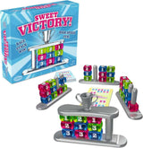 Board game set with colorful number cubes and 'Sweet Victory!' packaging on a white background