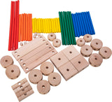 Assorted wooden Makit Toy pieces including rods, blocks, and rings on a white background