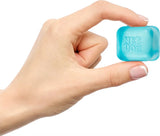 Hand holding a small blue NeeDoh - Nice Ice Baby  on a white background