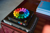 Colorful IQ Deluxe - Circle puzzle on a book with a blurred background