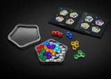 Colorful IQ Deluxe - Pentagon pieces on a black surface with puzzle board and trays.