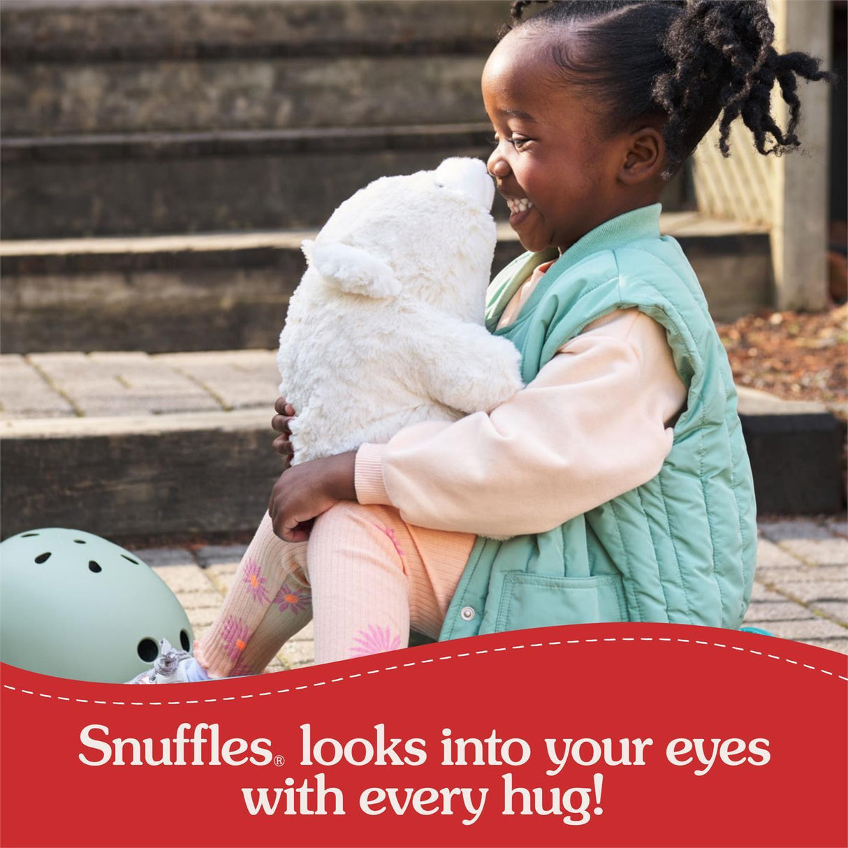 Child holding a stuffed Forever Friends: Snuffles, 10-Inch with promotional text about 'Snuffles' toy.