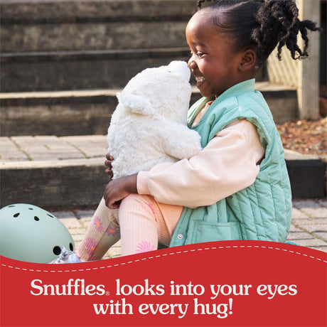 Child holding a stuffed Forever Friends: Snuffles, 10-Inch with promotional text about 'Snuffles' toy.