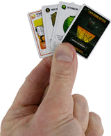 Hand holding a set of World's Smallest Exploding Kittens  cards with humorous designs on a white background