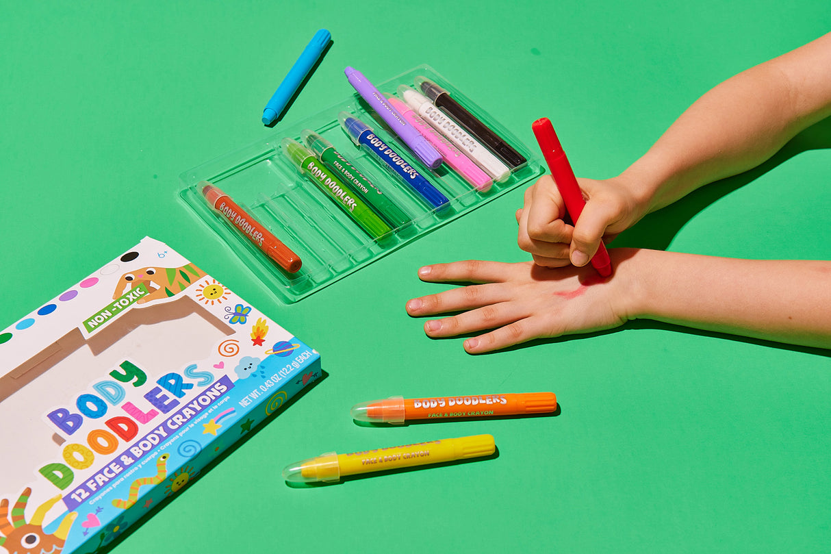 Body Doodlers 12 Face & Body Crayons on a green background