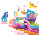 Colorful Hey Clay Rainbow Unicorns on a rainbow path with a castle in the background