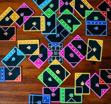 Tacta Card Game with colorful geometric cards on a wooden surface