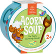 Children's game box titled 'Acorn Soup' with a cartoon squirrel and wooden spoon on a white background.
