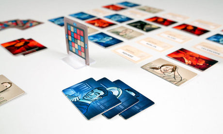 Collection of Codenames cards with various designs on a white surface