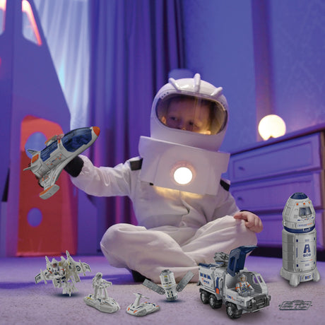 Child in an astronaut costume playing with Mega Space Explorer Set toys in a room with purple walls.