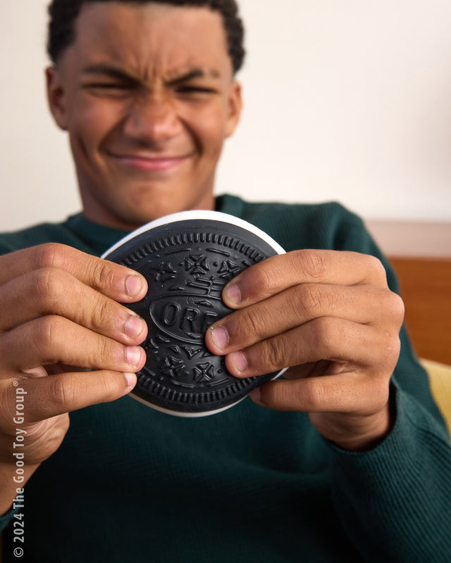 Person holding a large Oreo Squishi Toy