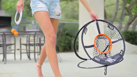 Person holding a Djubi DartBall outdoors