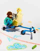 EzyRoller Classic - Blue with plush animals on a white surface with crayon drawings