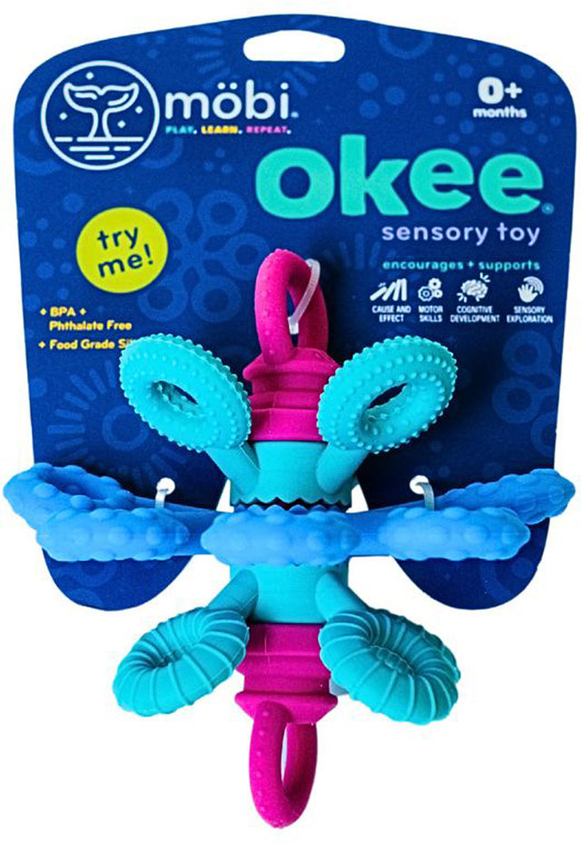 Okee Toy , Blue and pink sensory toy with packaging featuring the Mébi brand.