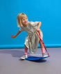 Child playing with a blue The Spooner Mini Pro Born to Ride Training System - 20" against a blue background