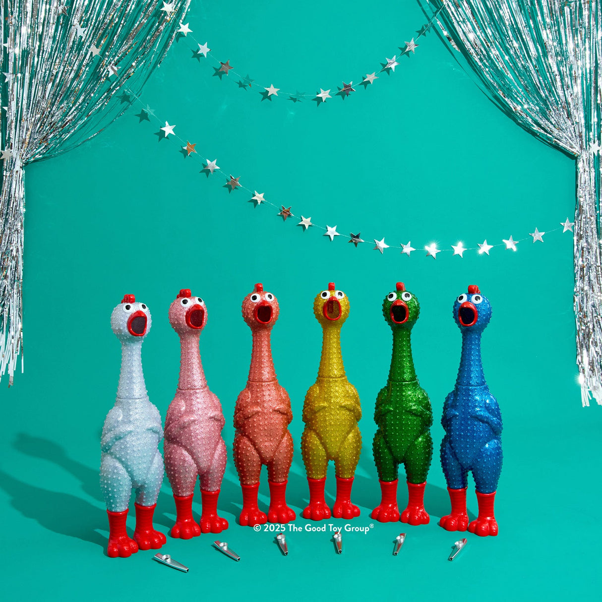 Giant Sparkle Rubber Chicken with red feet on a teal background with decorative string lights.