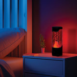 Motionz Volcano Light on a nightstand with a cozy bedroom setting