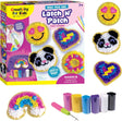 Creativity for Kids Latch N' Patch Fuzzy Stickers craft kit, showing the colorful retail box, several finished fuzzy patch stickers including smiley faces, a panda, and a rainbow, plus the included hook sticks and paint tubes on a white background.