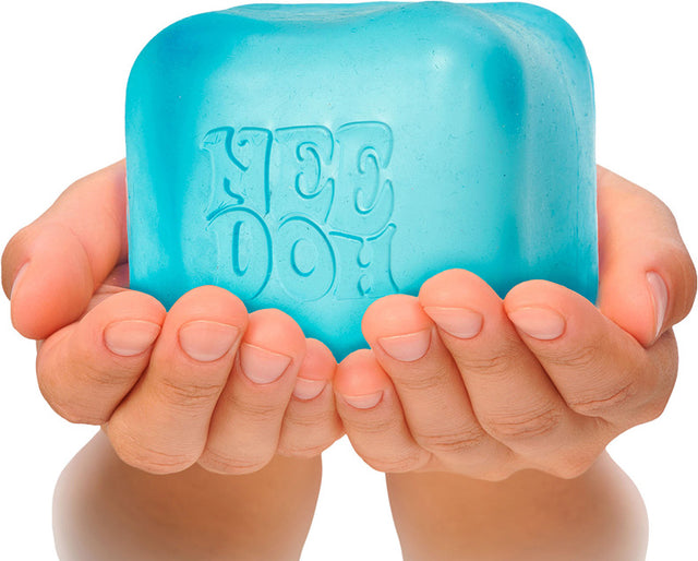 Blue NeeDoh Nice Berg held in hands against a white background