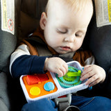Child playing with a colorfulPlayTab Go in a car seat