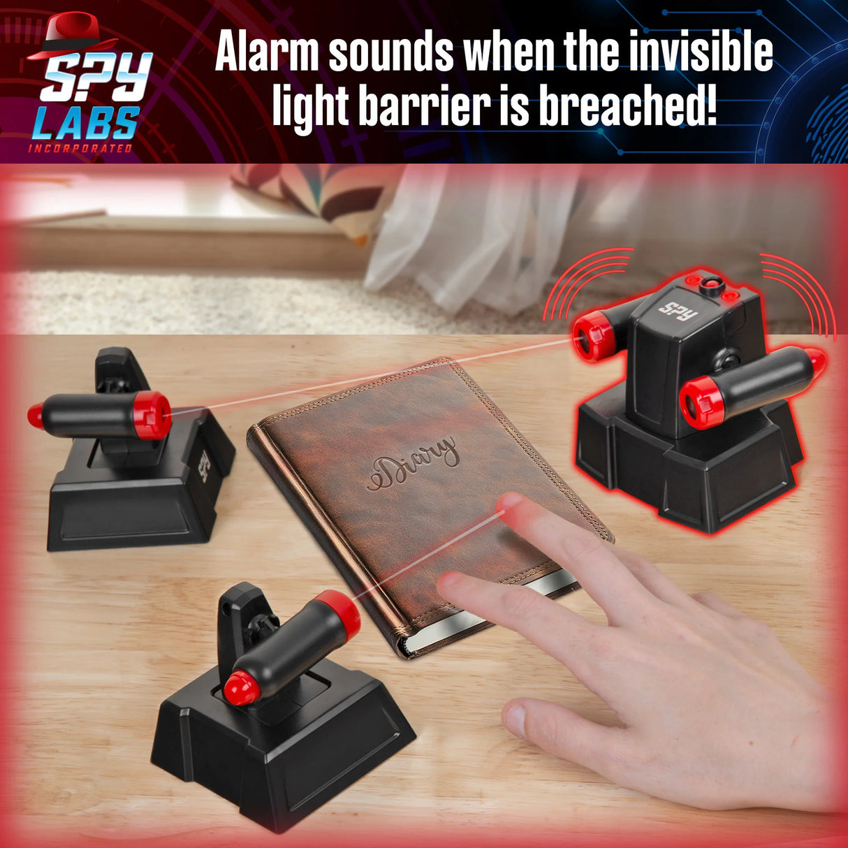 Invisible light barrier system with Spy Labs branding, showing an alarm triggered by a hand approaching a diary.
