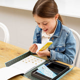 Young girl in a denim jacket interacting with a Flip Book Kit - Animation In Action on a table.