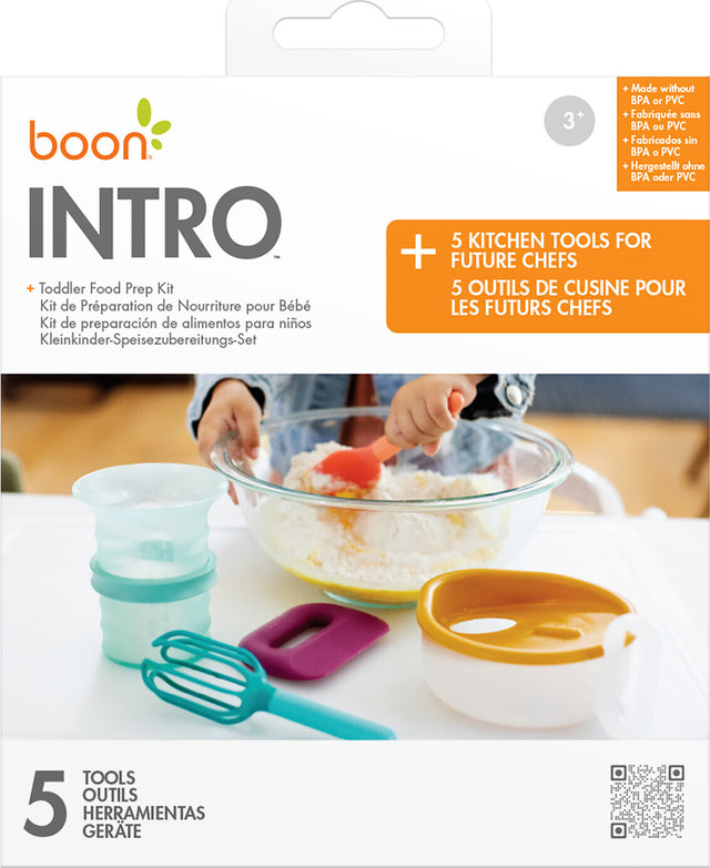 Boon Intro toddler food prep kit packaging with tools and a child using them.