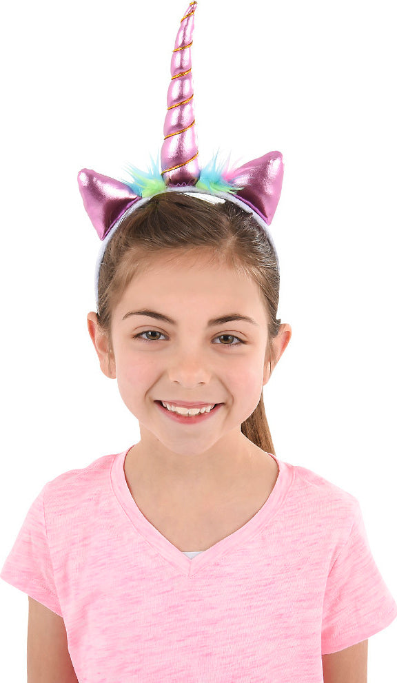 Child wearing a Metallic Unicorn Headband with a white background