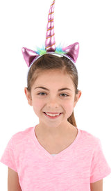 Child wearing a Metallic Unicorn Headband with a white background