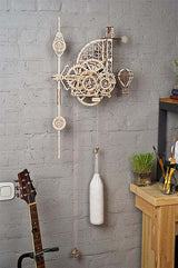 UGears Aero Clock on a gray brick wall.