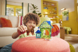 Child playing with the Dog House - 13 Piece Set on a pink cushion in a bright room.