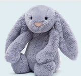 Bashful Viola Bunny Medium plush featuring soft, lavender fur with long floppy ears and a gentle expression, perfect as a cuddly toddler toy or gift.