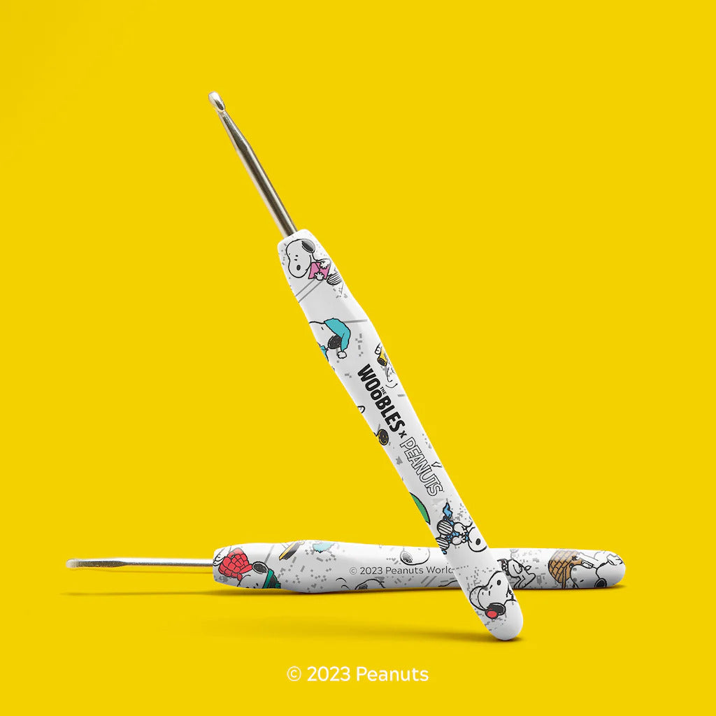 Two crochet hooks on a yellow background with 'Peanuts' branding.